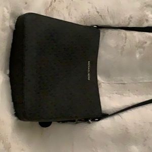 Michael Kors crossbody.  Inside & outside pocket.  Zippered for safety.